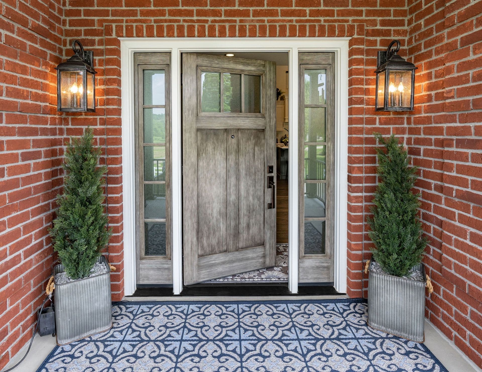 Entryway door in natural leather on brick house