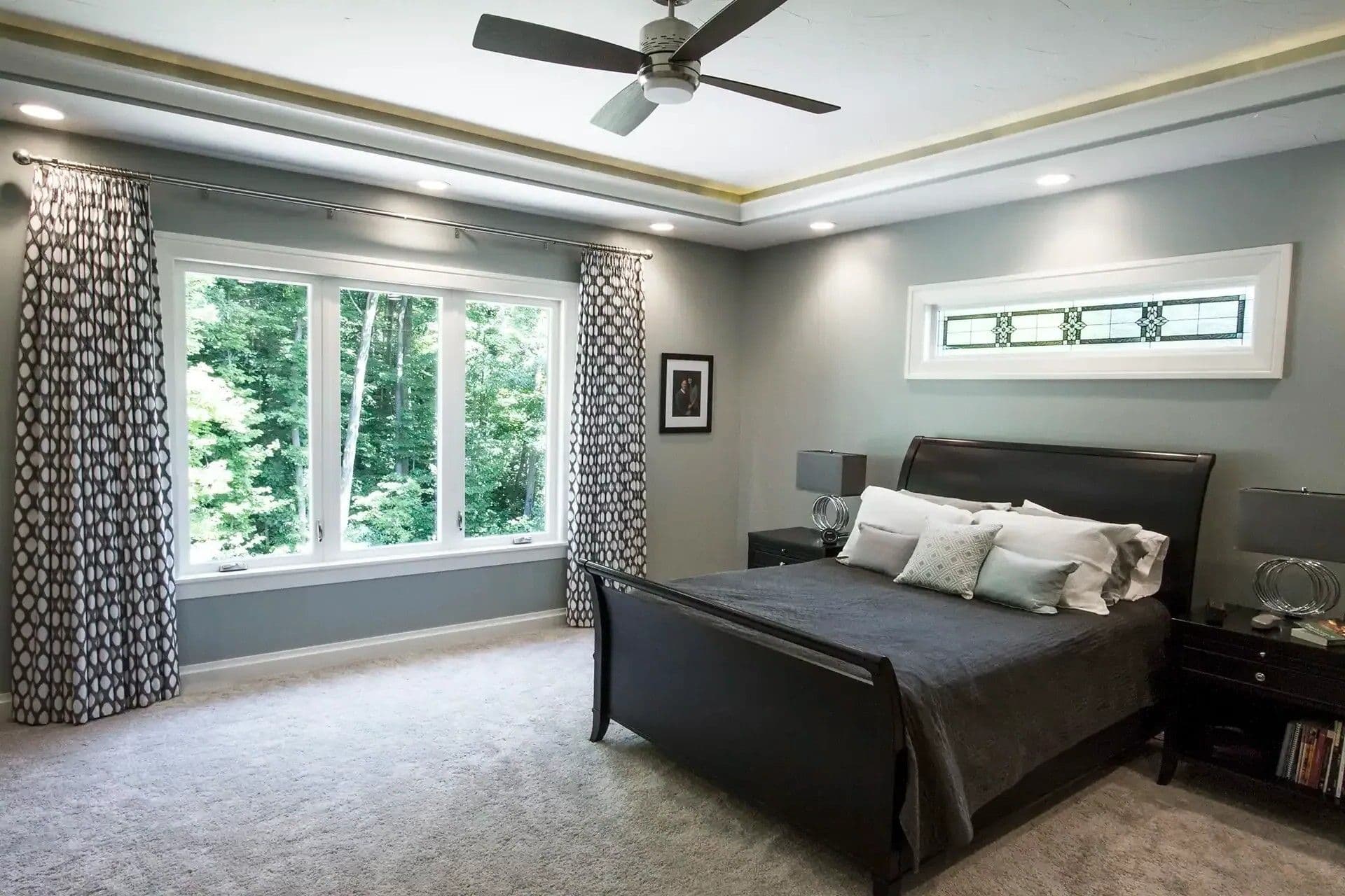 Aeris shaped wooden picture windows in master bedroom