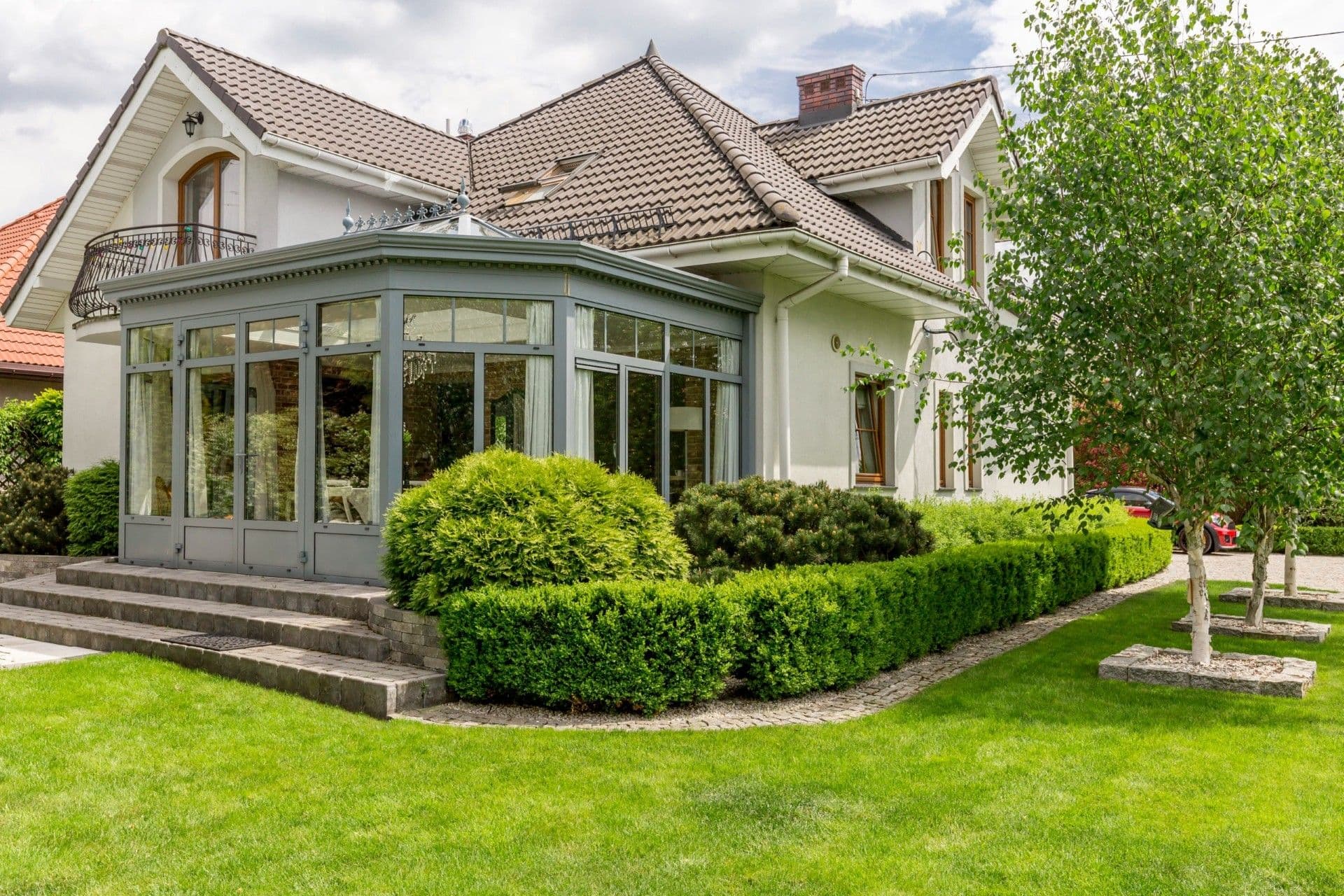 Modern house with glazed arbor and patio enclosure