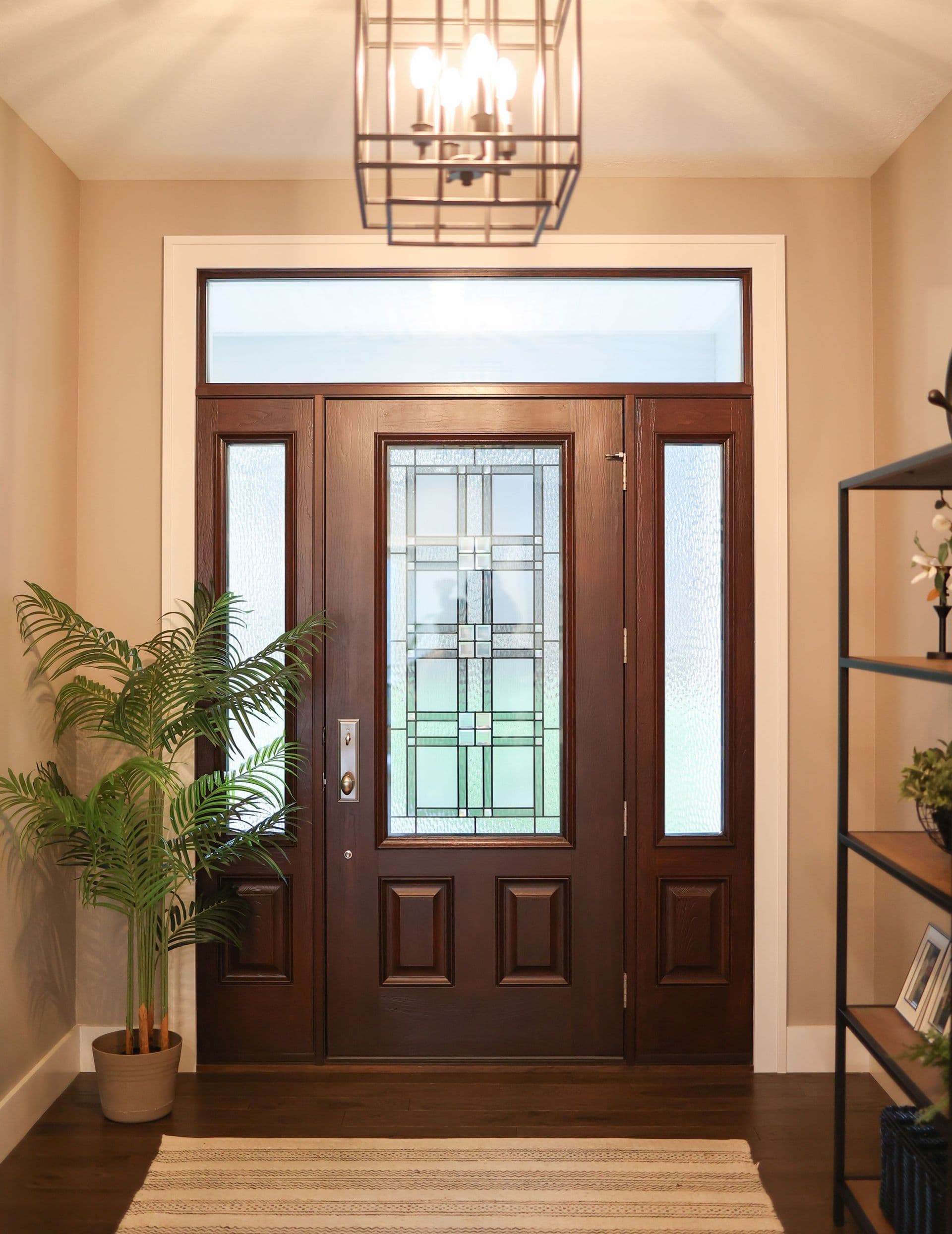 Indoor view of Embarq cherry hazelnut door with decorative glass