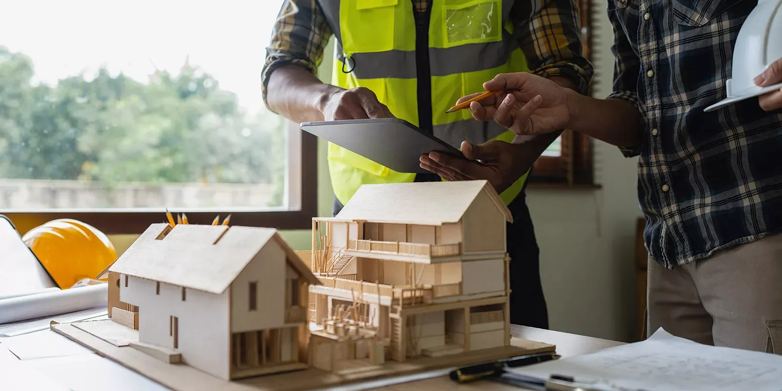 Contractor and construction working designing house build