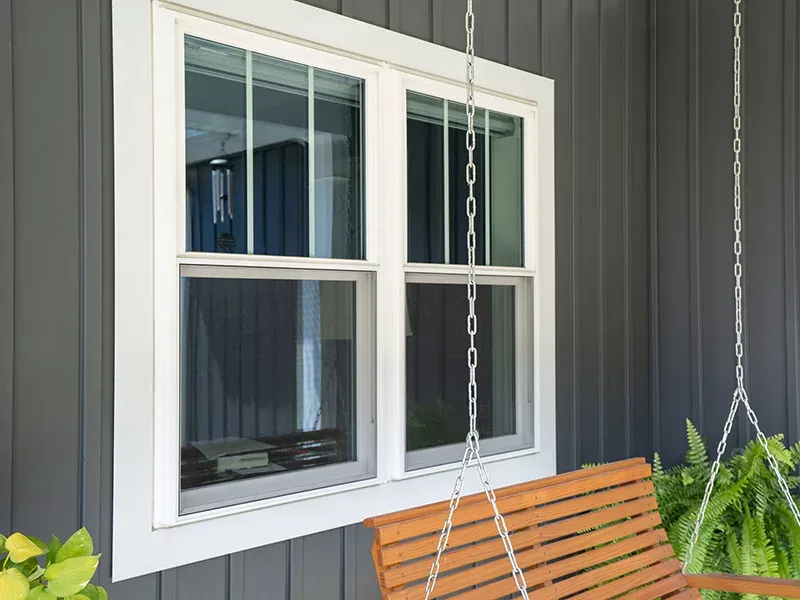Vinyl window with porch swing